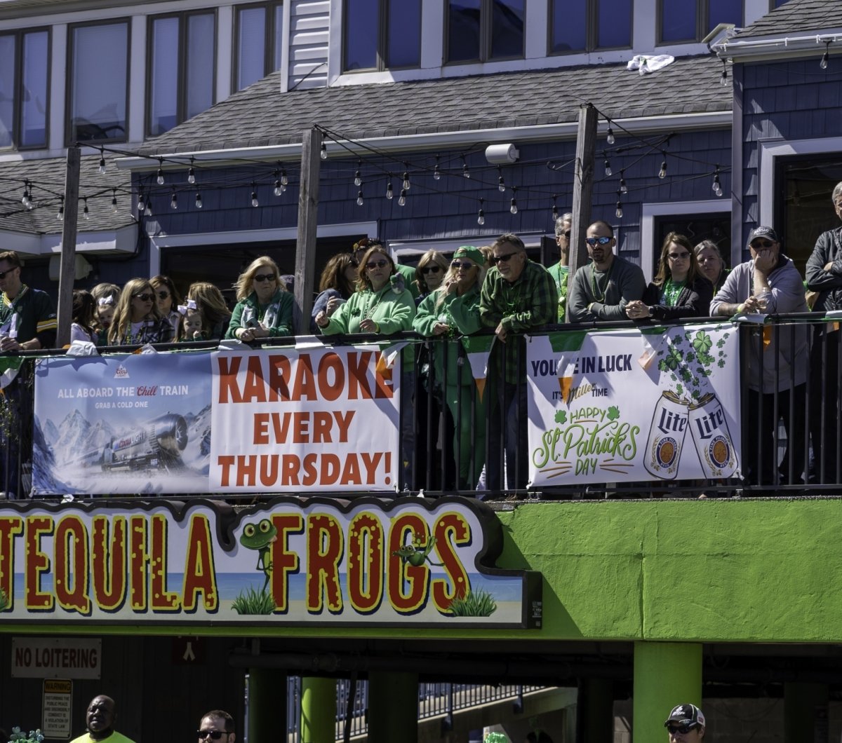 People watching the parade at Tequila Frogs